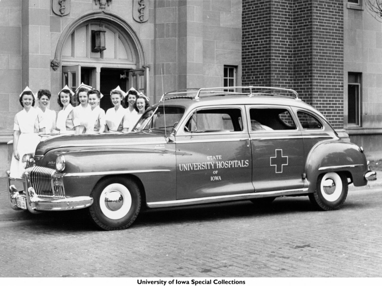 1947 Nursing students posing with an ambulance