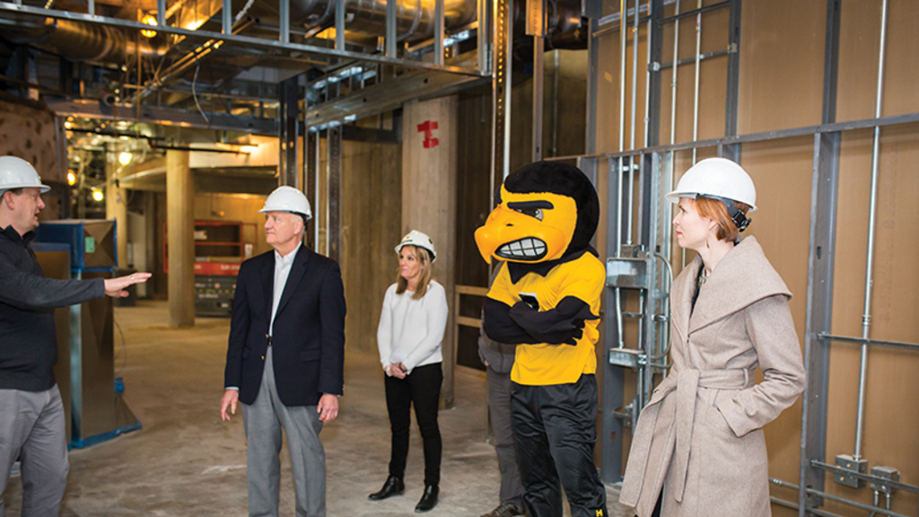 group of people in hard hats with herky in nursing building