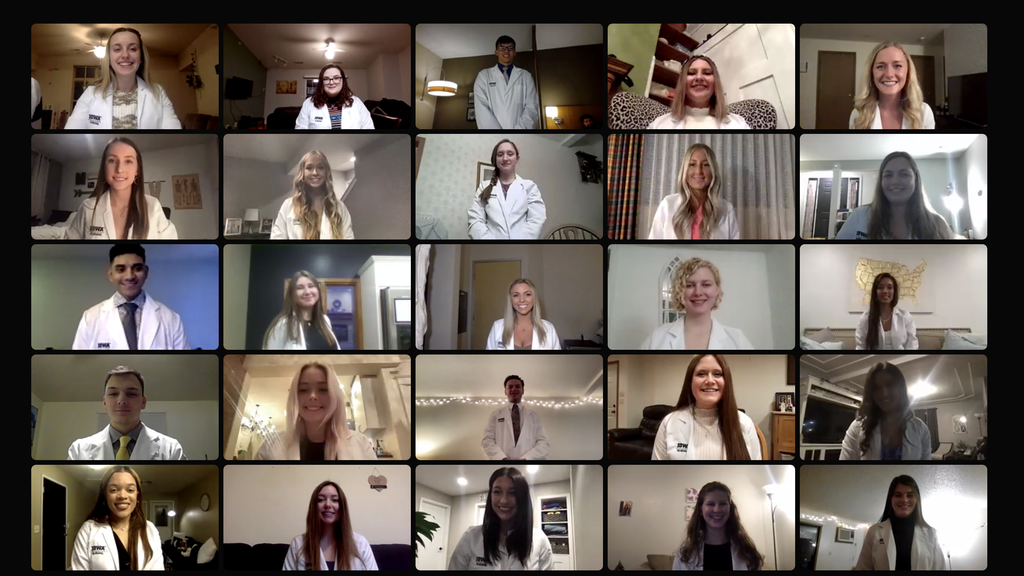 Newly coated nursing students smile on a zoom webinar